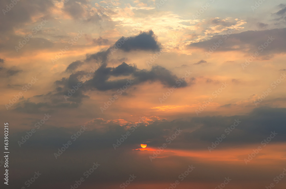 Clouds with light rain, the sun is about to fall evening.