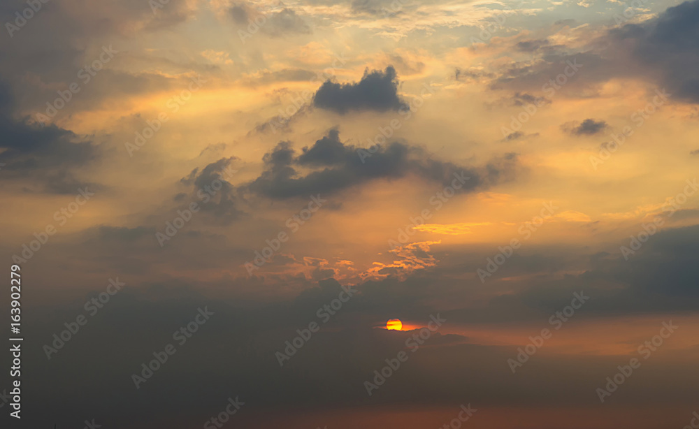 Clouds with light rain, the sun is about to fall evening.