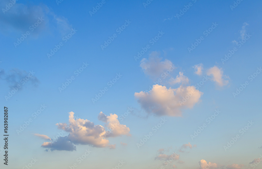 Blue skies with some clouds in the sky is bright.