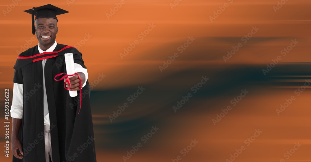 Graduate man smiling against blurry orange abstract background