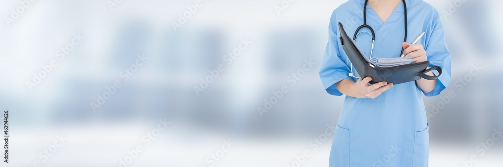 Doctor holding files and folders with blurred background