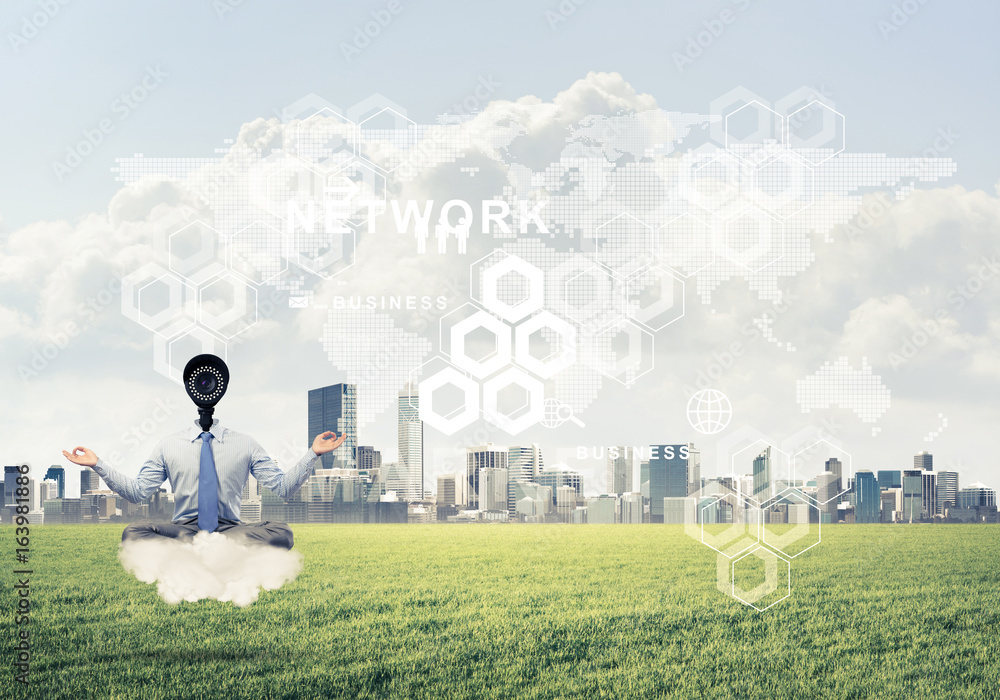 Camera headed man sitting in lotus pose on cloud against modern 