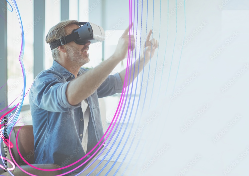 Excited man in VR headset touching clouds and light interfaces