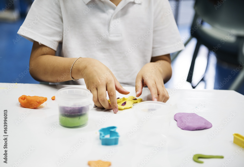 Kindergarten students learning shape with colorful clay