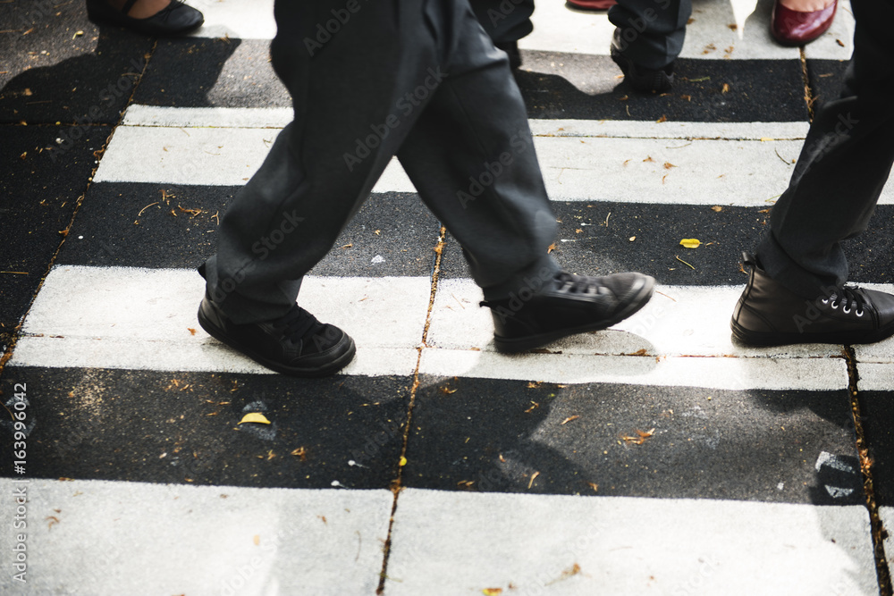 Kindergarten students walking crossing school road