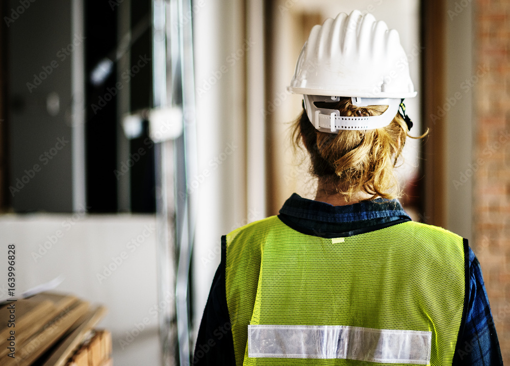 Woman constructor wearing security clothing