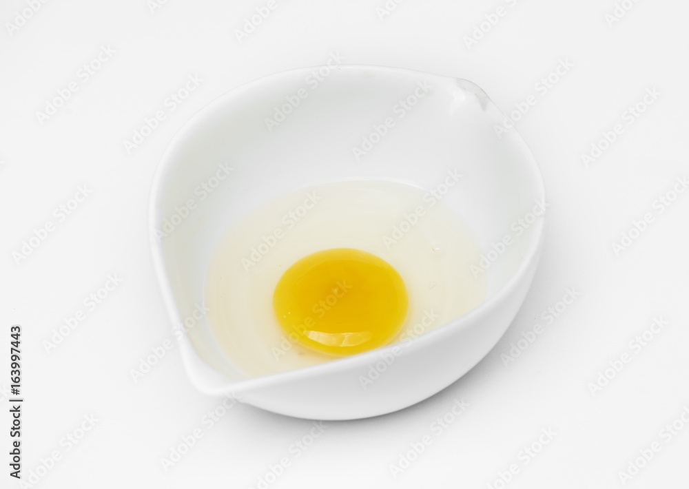 Closeup of fresh organic egg yolk in cup