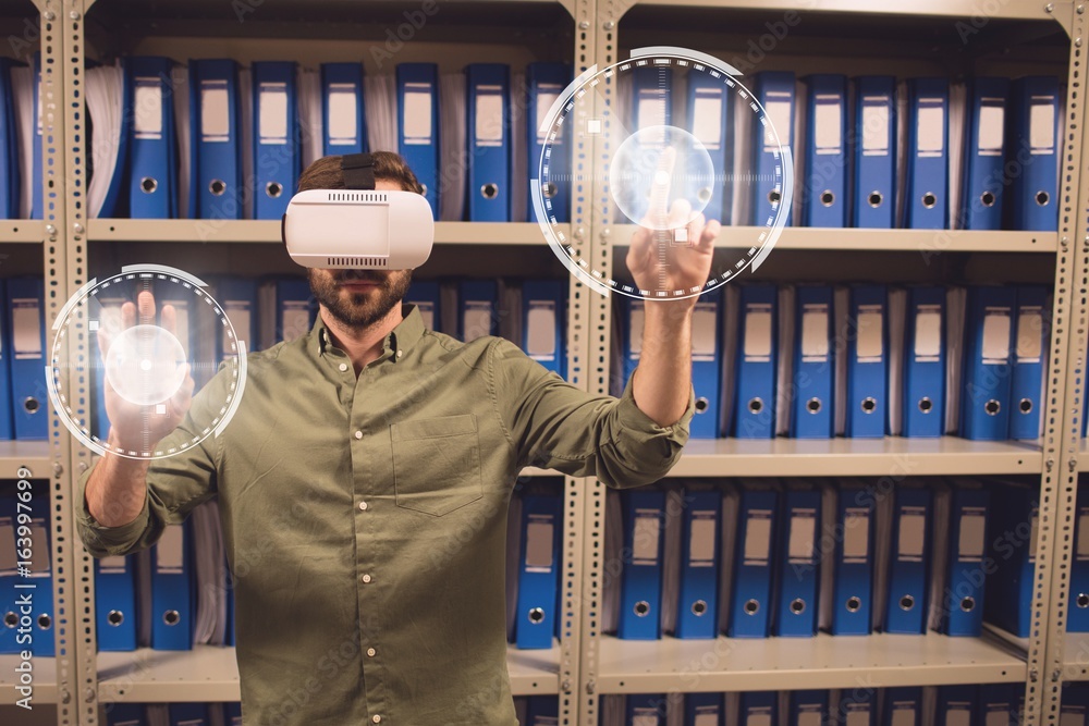 Man in VR headset touching interfaces with flares