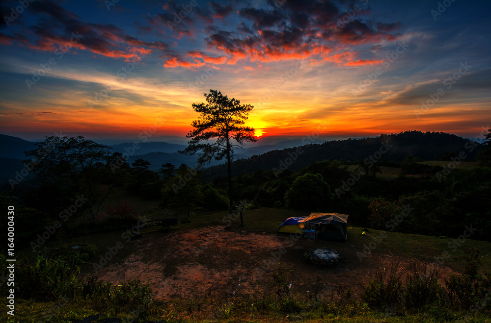 Tent on the mountain with sunset light.