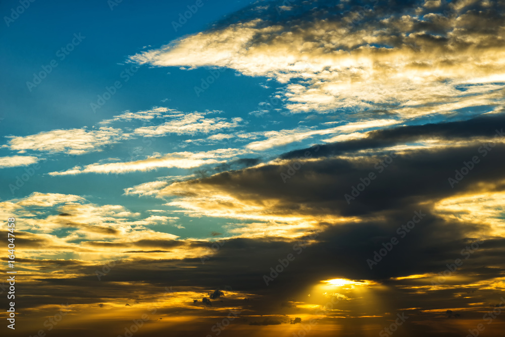 Storm clouds in the sky.And the light of sunset.