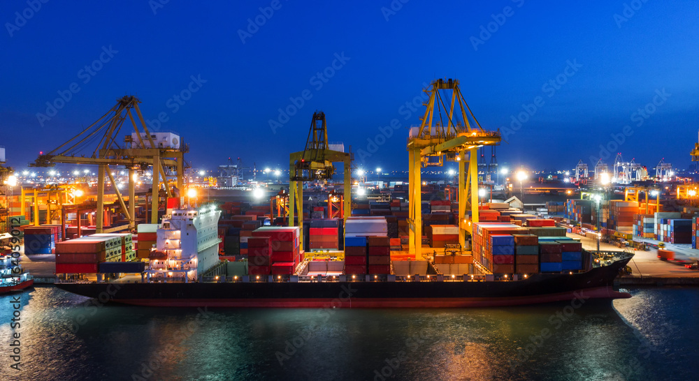 container ship in import export and business logistic.By crane ,Trade Port , Shipping.cargo to harbo