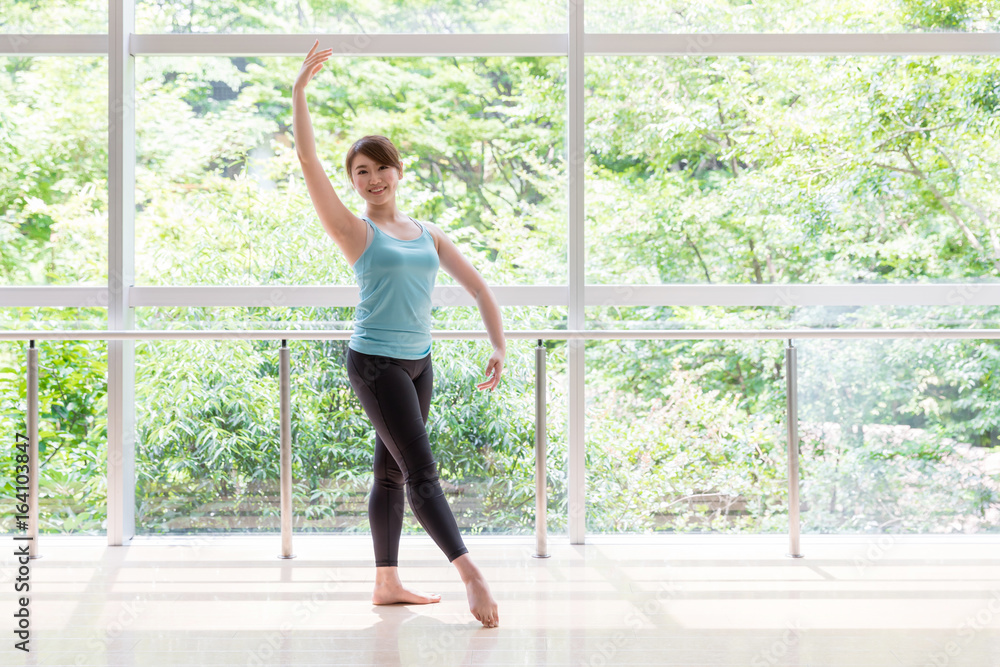 attractive asian woman doing ballet