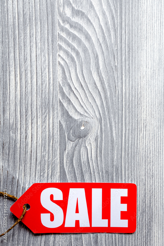 concept of sale on wooden background top view