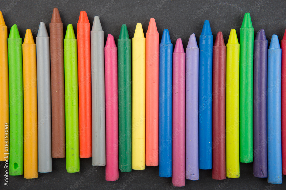 colored crayons on the blackboard