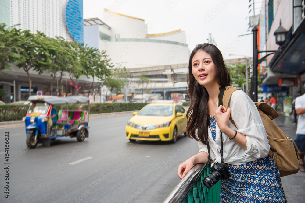 Asian woman with tuk tuk car in thailand.