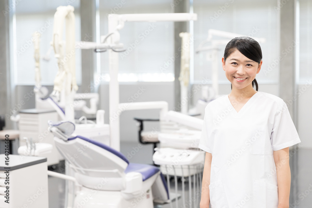 portrait of asian dentist in dental clinic