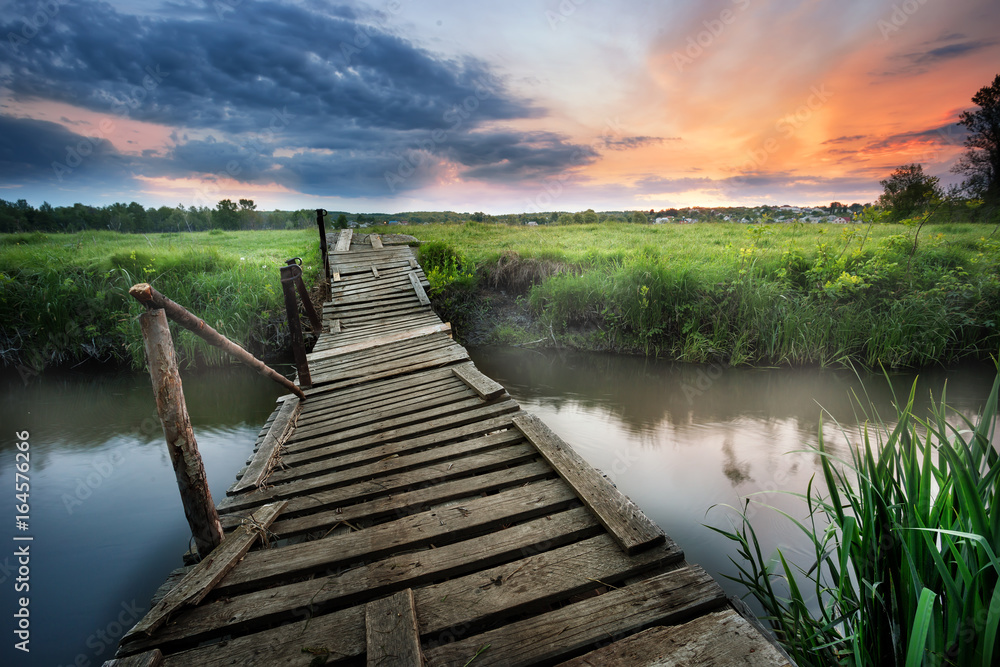 Old wooden bridge over the river