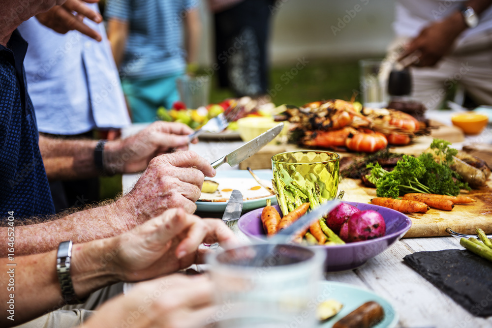 Closeup of diverse people enjoying barbecue party together