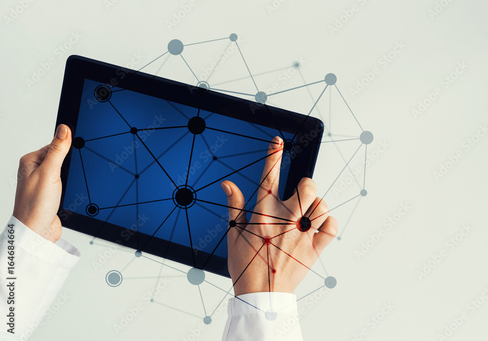 Close of female doctor hands working with tablet pc computer