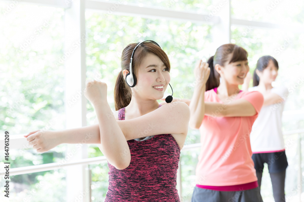 attractive asian women exercising in sports gym