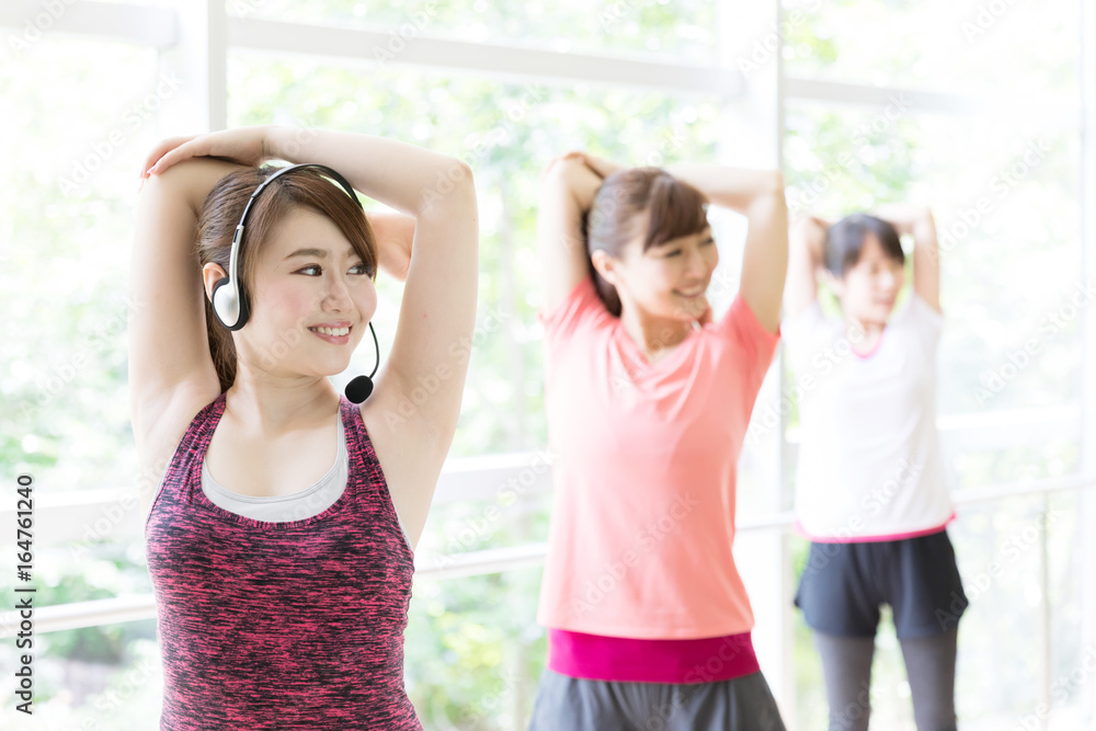 attractive asian women exercising in sports gym