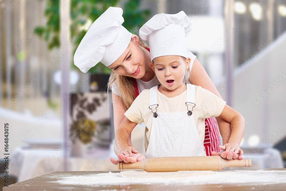 Mother and child cooking.