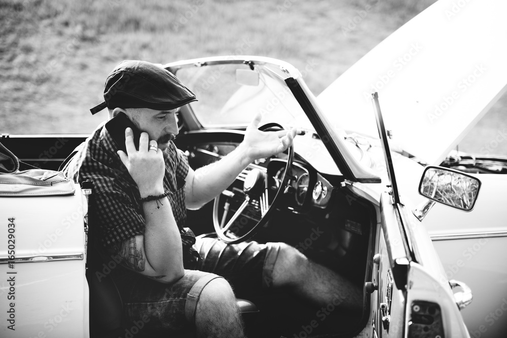 Men Calling Mechanic for Broke Down Car on Street Side with Open Hood