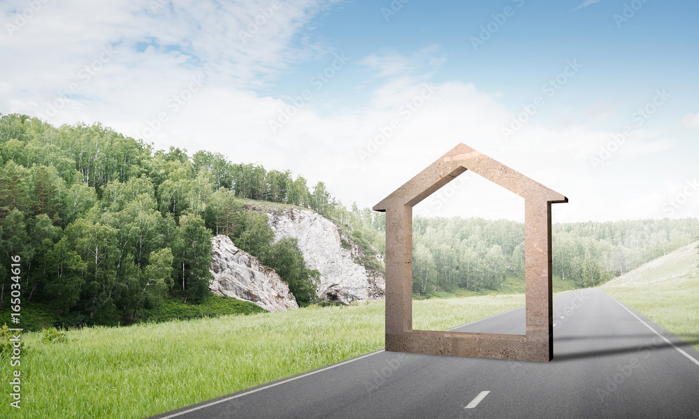 Conceptual background image of concrete home sign on asphalt road