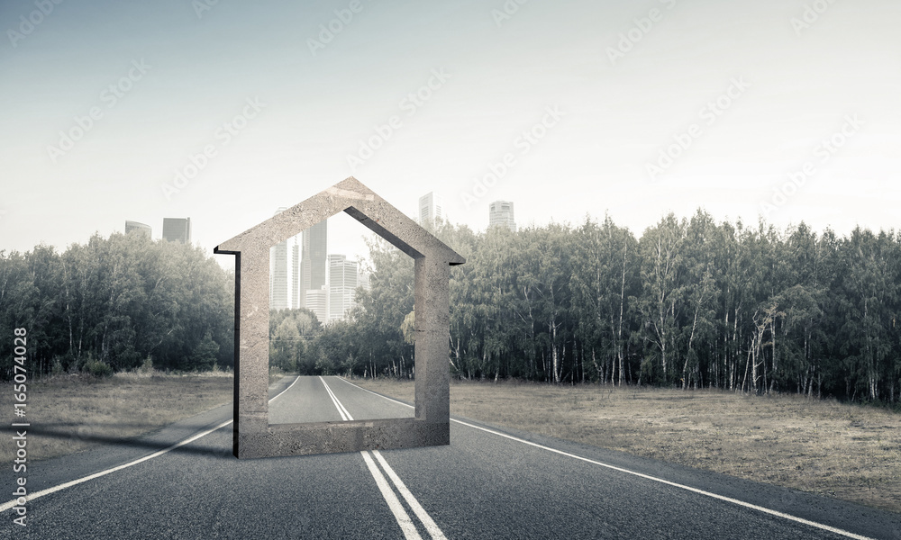 Conceptual background image of concrete home sign on asphalt roa