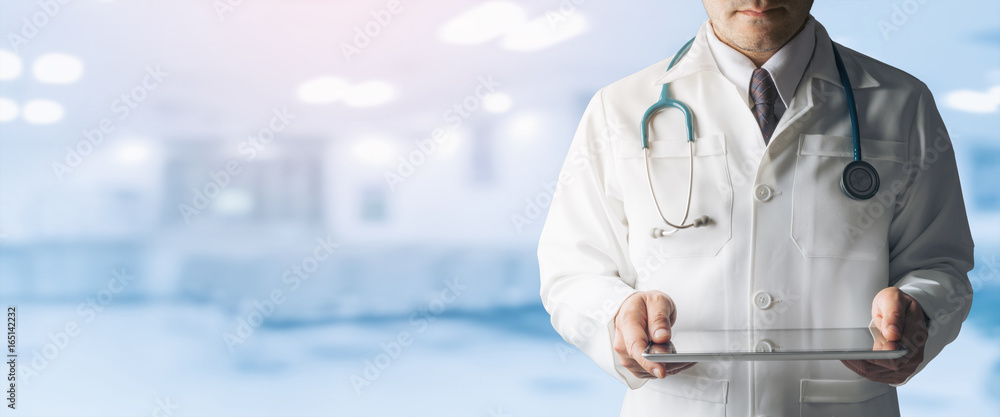 Male Doctor Holding Tablet Computer