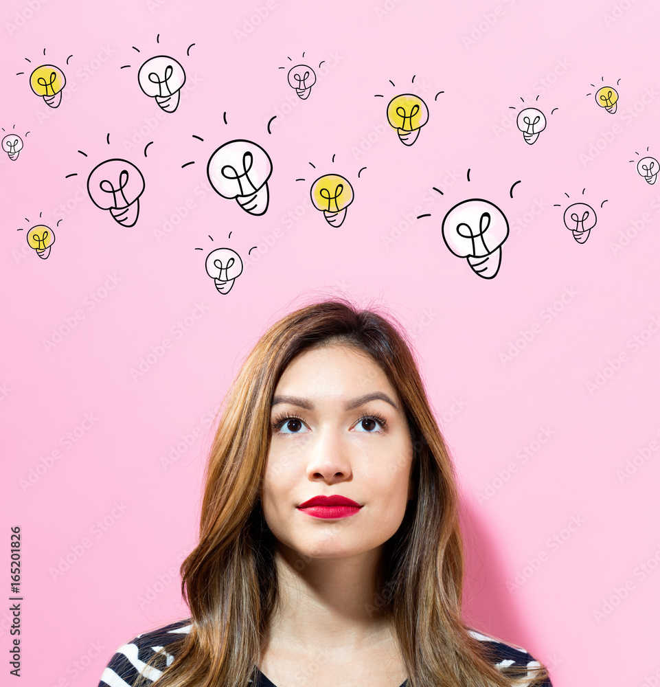 Light Bulbs with young woman on a pink background