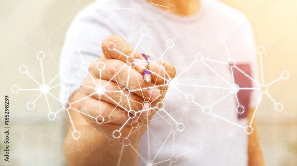 Businessman drawing digital data network with a pen