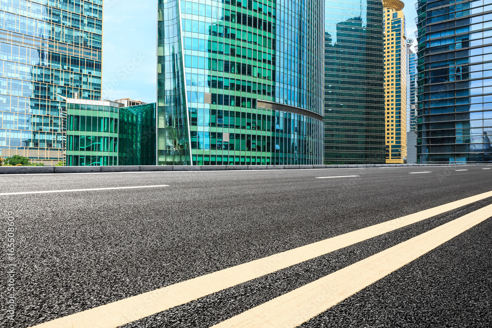 empty asphalt road and modern buildings in shanghai,china.