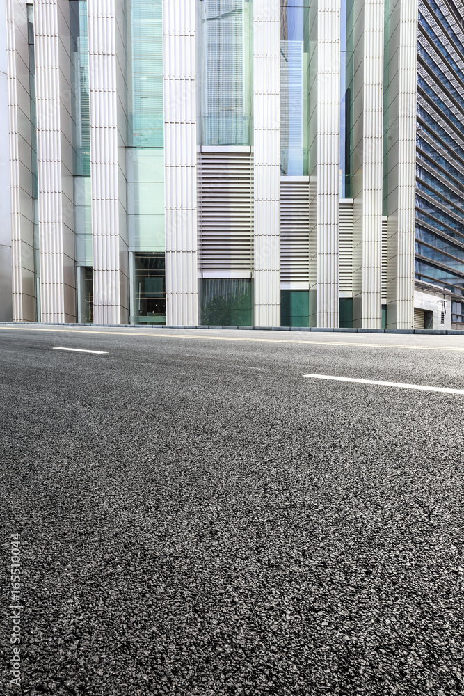 empty asphalt road and modern buildings in shanghai,china.