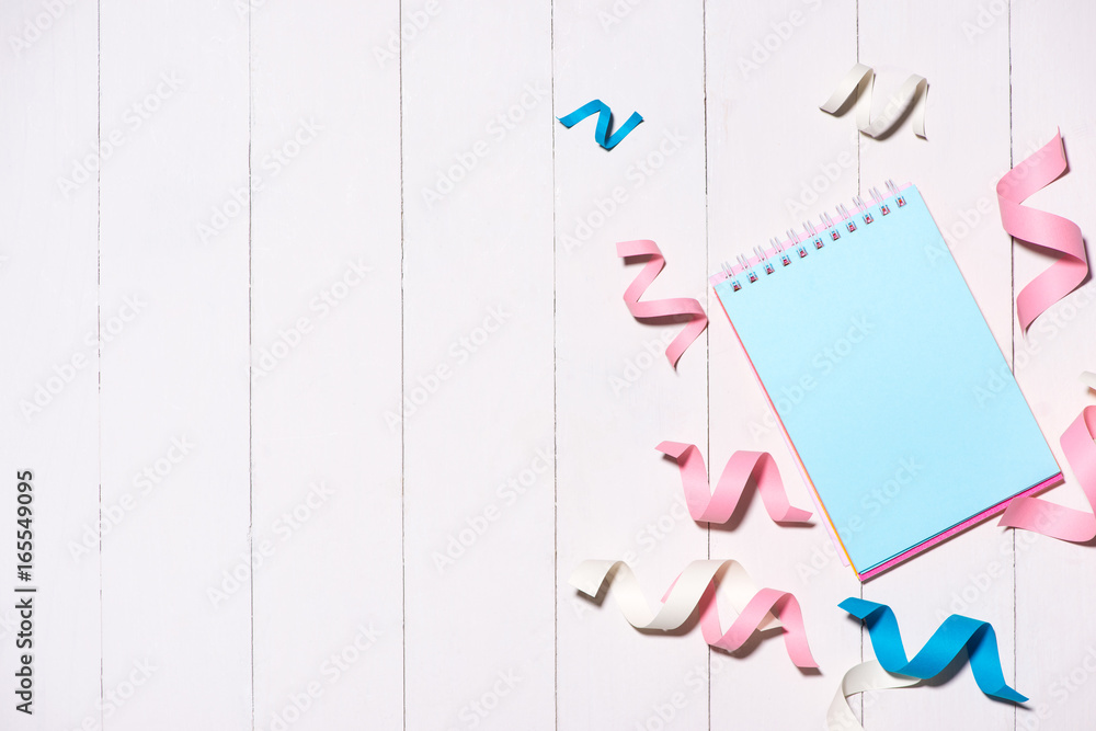 Celebration Flat lay with colorful party items on wooden background.