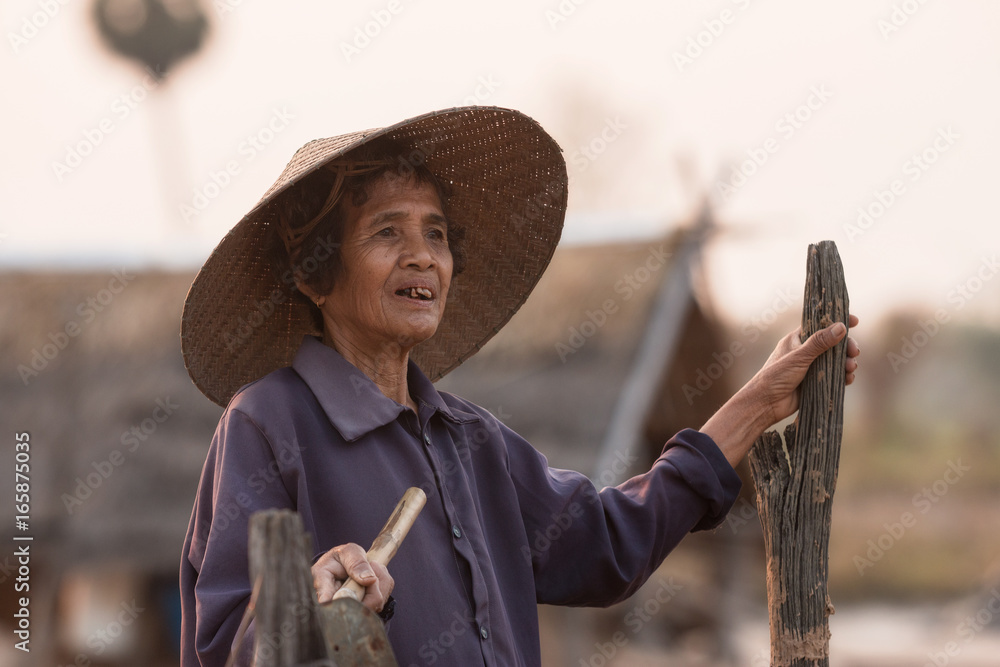 Farmer Ancient salt,Woman working on salt field in Thailand,Ancient salt making,career in salt farmi