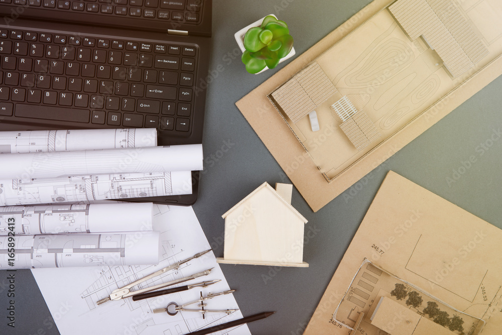 Workplace of architect - construction drawings, scale model and tools