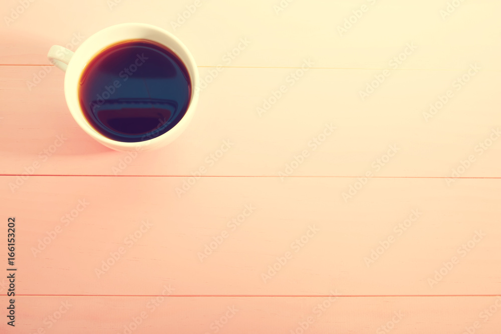 Coffee mug on a bright pastel pink background