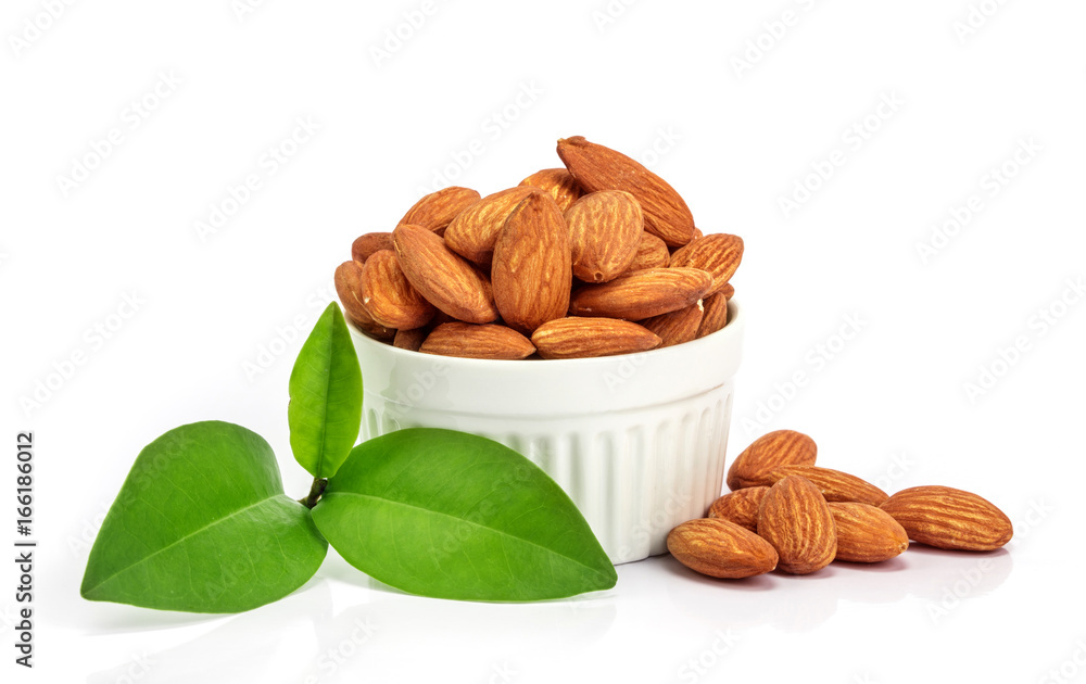 the fresh almonds in white cup on white background