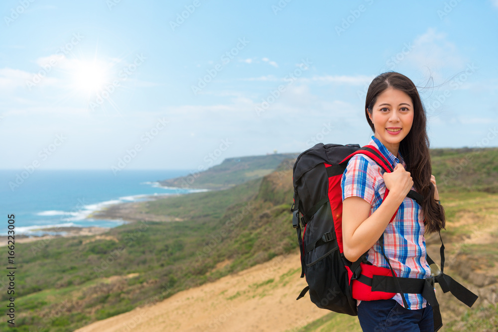 female climber woman carrying hiking backpack