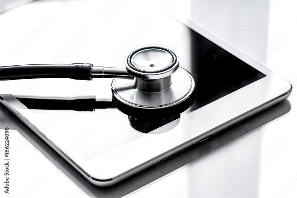 diagnostic of gadgets on white background with stethoscope