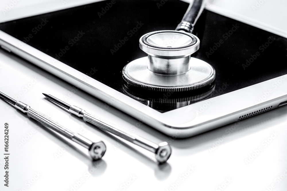 diagnostic of gadgets on white background with stethoscope