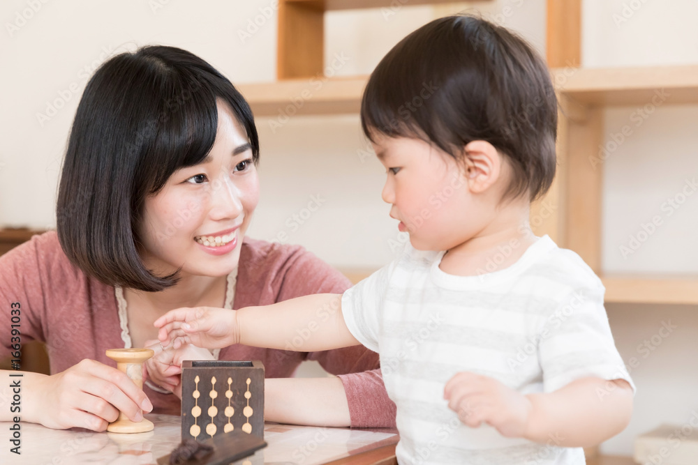 asian baby playing blocks