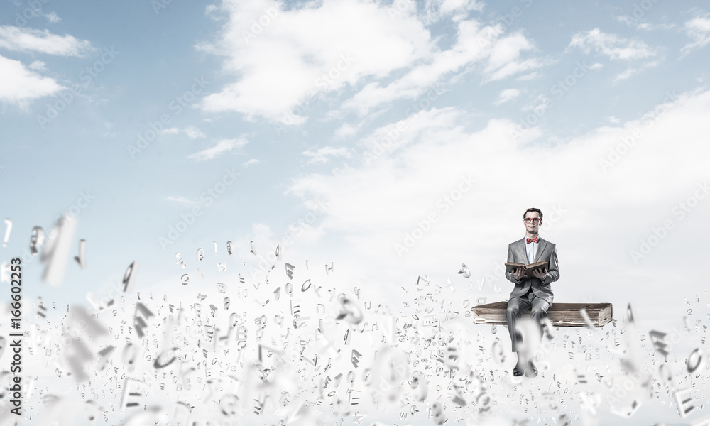 Young businessman or student studying the science and symbols fl