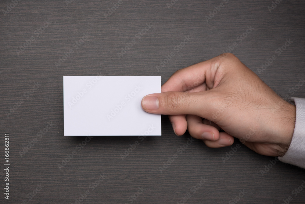 Mockup of white business cards in mans hand