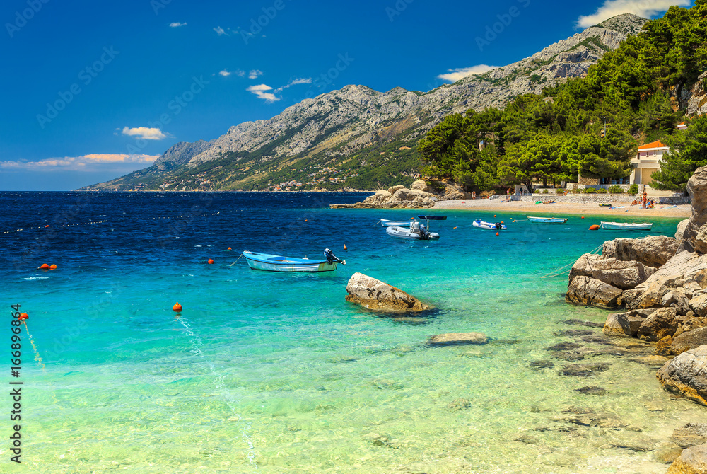 Mediterranean bay and beach with motorboats, Brela, Dalmatia region, Croatia