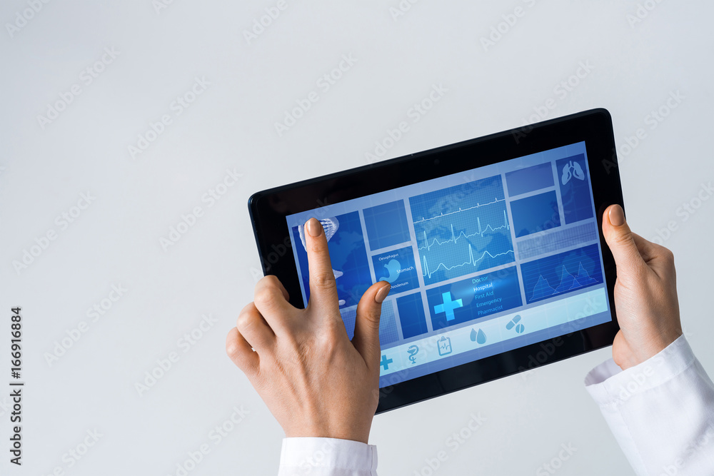 Close of female doctor hands working with tablet pc computer