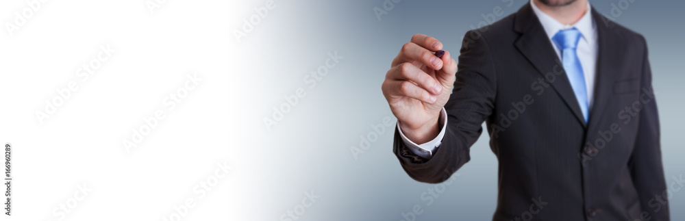 Panorama view of a businessman writing with a pen