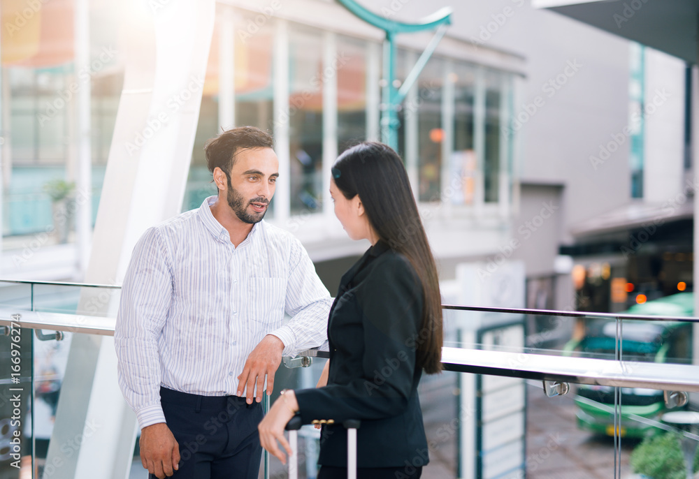 Business colleagues talking together outdoor