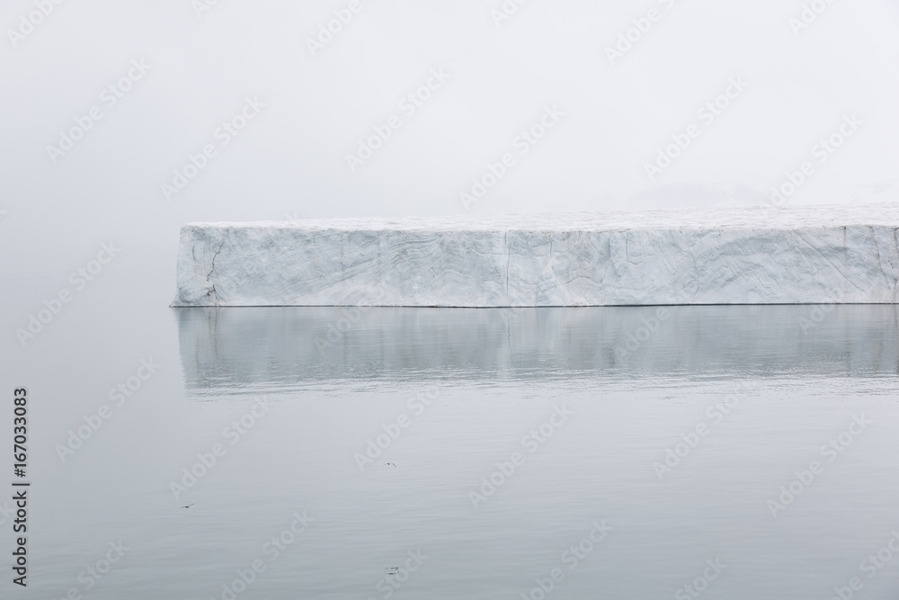 Iceberg floats in the polar sea of ​​Svalbard, Spitsbergen, Norway